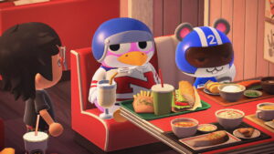 My Animal Crossing character, Puck, and Agent S hanging out in a diner with red color decor. The table has several trays of food.
