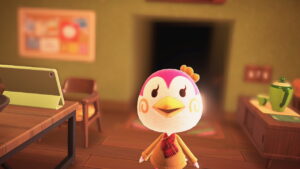Close up of Midge in her home, which is blurred in the background.